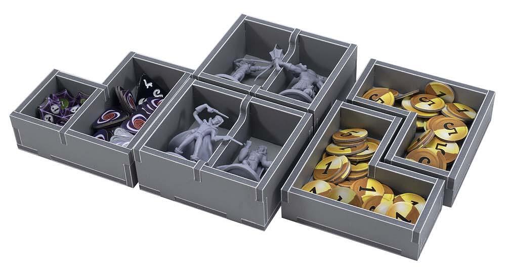 Game tokens, cards, and pieces neatly arranged in Folded Space insert trays
