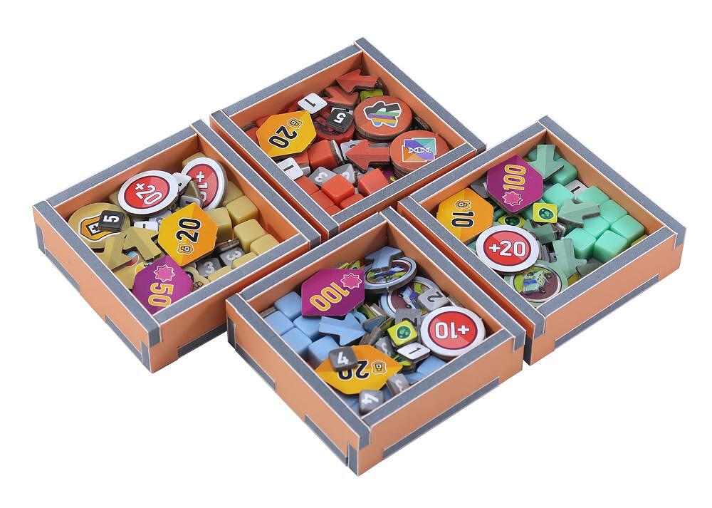 Folded Space Dinosaur World organizer insert trays filled with game tokens