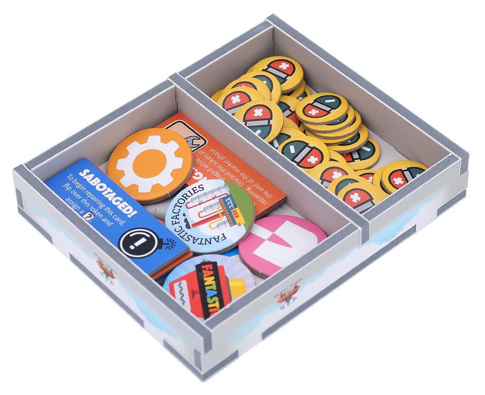 Side view of organized game components using Folded Space insert for Fantastic Factories