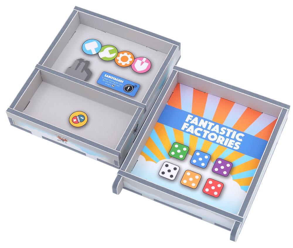 Angled top-down view of insert layout inside Fantastic Factories game box