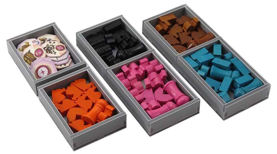 Open game box showing Folded Space insert filled with Five Tribes components