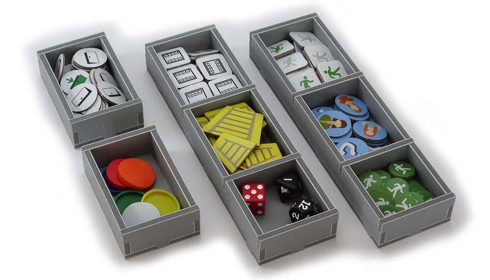 Folded Space insert organizer with game pieces arranged inside for Flash Point Fire Rescue