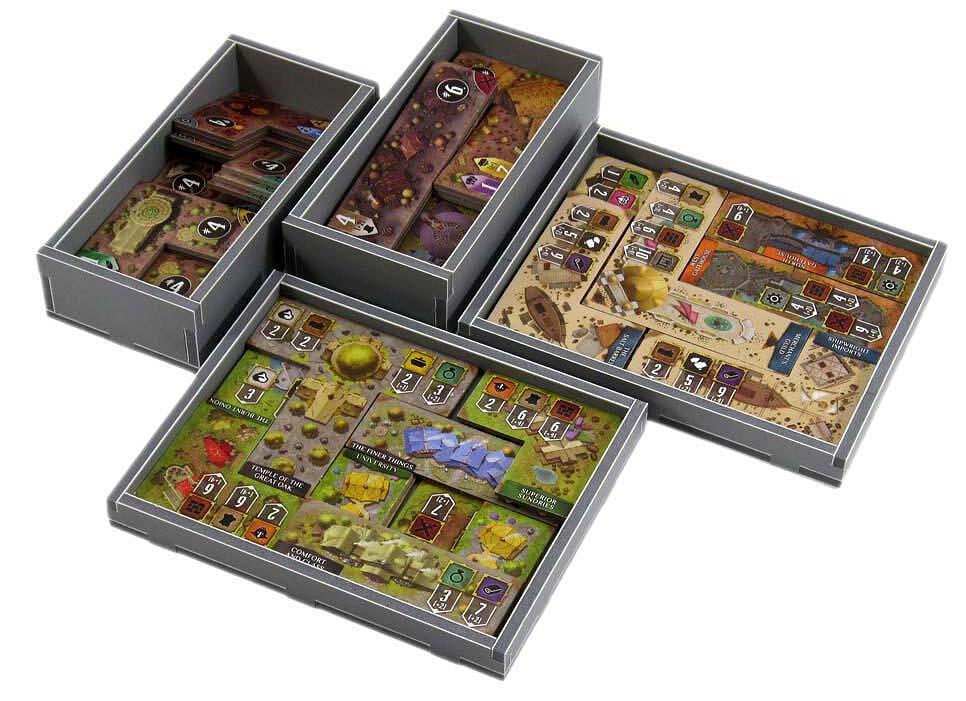 Top-down view of organized game components in Folded Space insert for Founders of Gloomhaven
