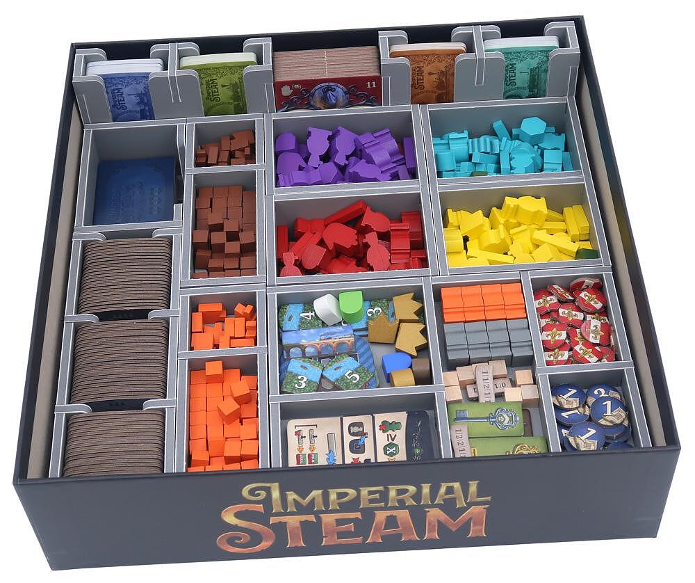 Close-up of layered tray system holding various game tokens