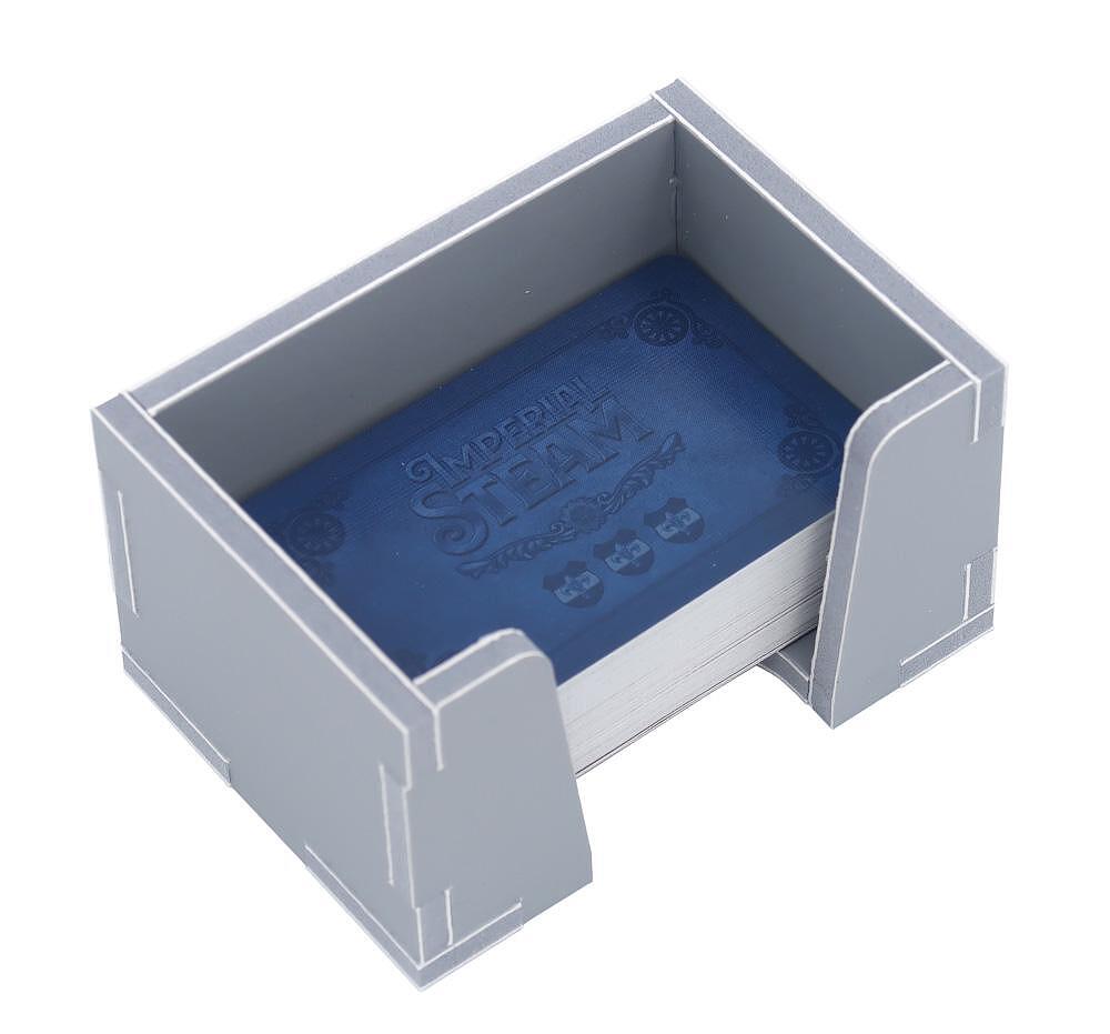 Overview of multiple insert trays beside the game box