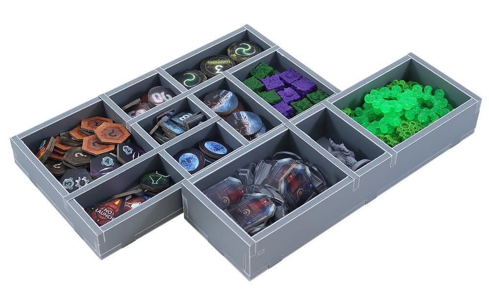 Close-up of internal trays in Folded Space organizer for tokens and cards