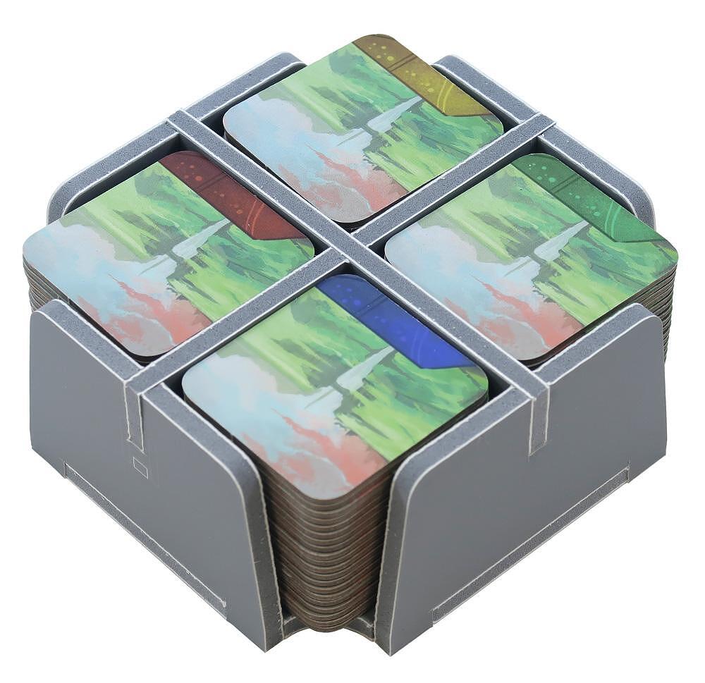 Close-up of multiple trays organized with game pieces