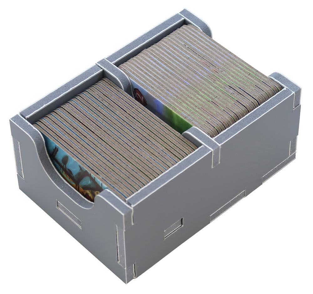 Organizer trays filled with sorted game tokens