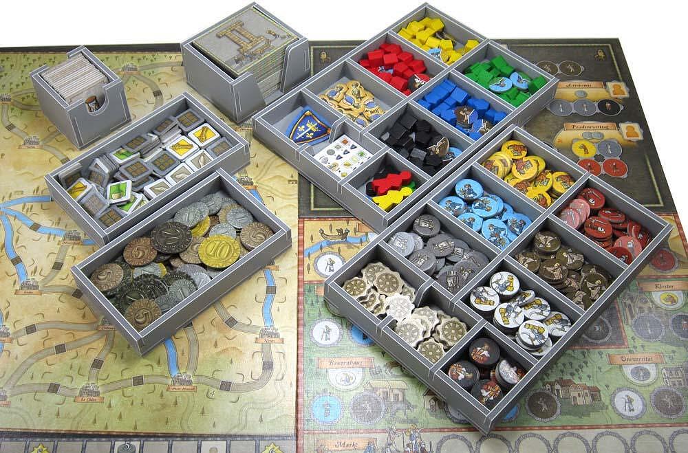 Orleans board game components neatly stored in Folded Space insert