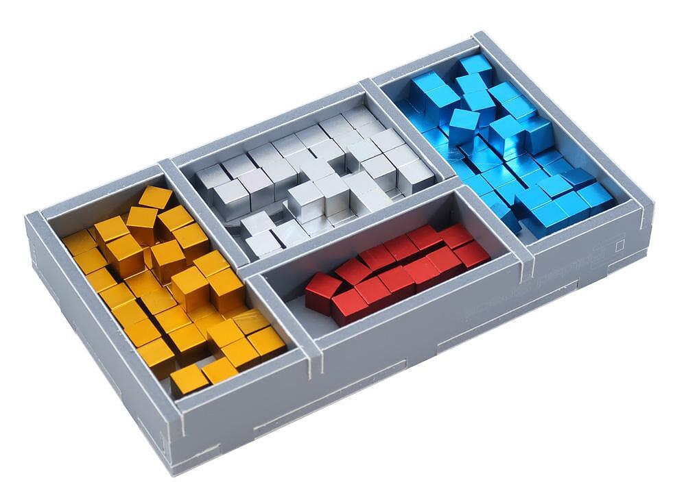 Game tokens and tiles neatly stored in custom Folded Space insert trays