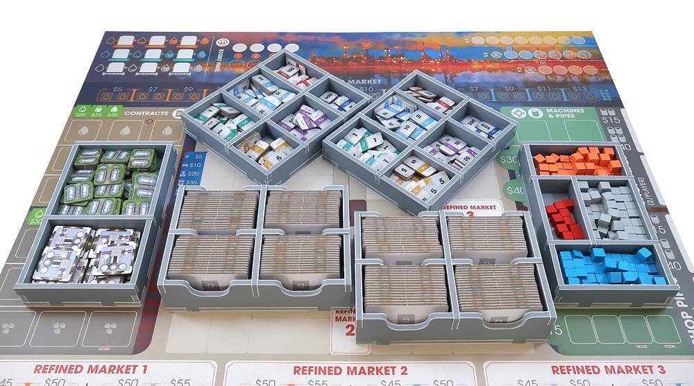 Full layout of Folded Space insert with game elements sorted in trays