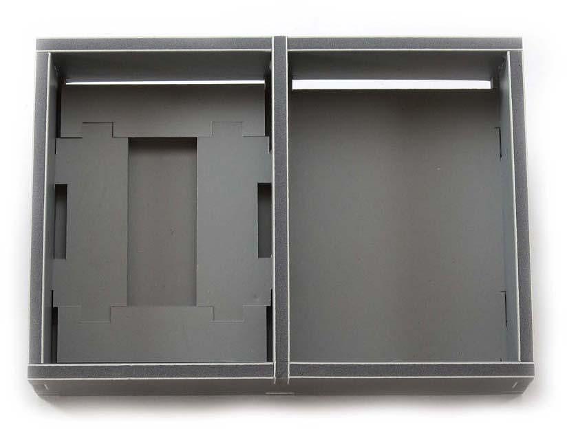 Top-down view of Folded Space game insert with Rising Sun miniatures and cards