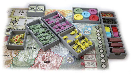 Detailed shot of Folded Space insert compartments holding Rising Sun game elements