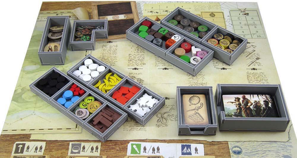 Game pieces placed in organizer trays