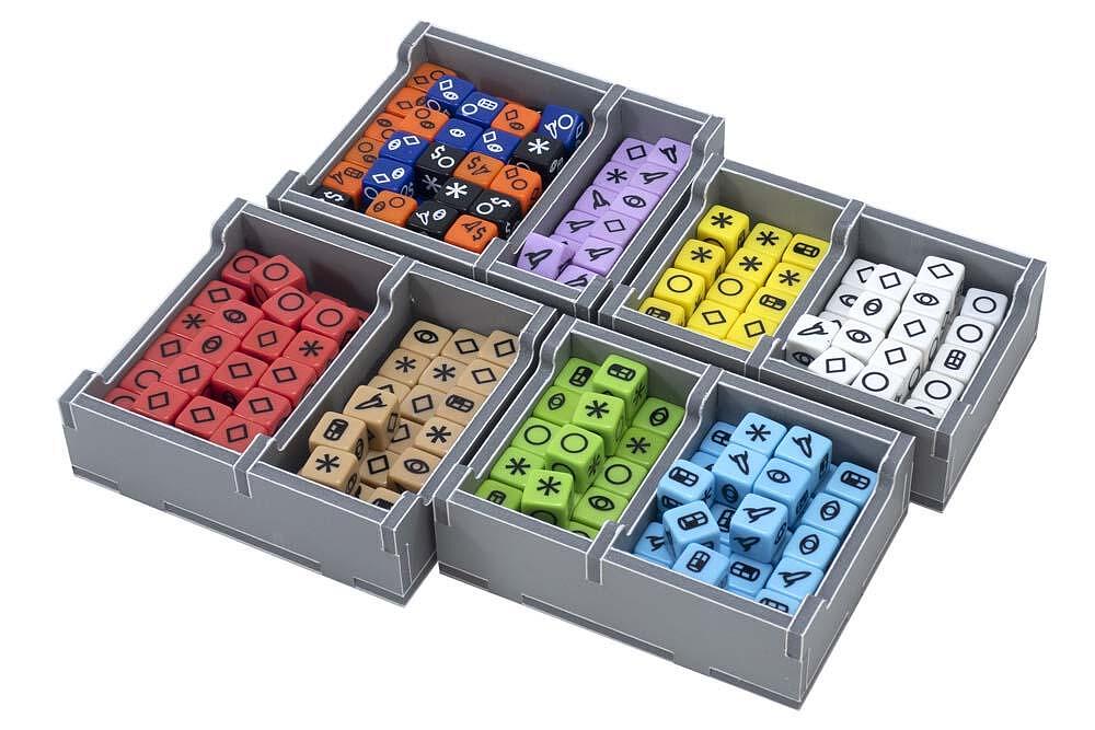 Close-up of Folded Space insert with compartments filled with game tokens and dice