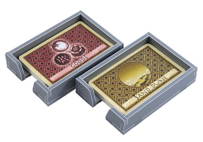 Game tokens stored in designated slots within Targi insert