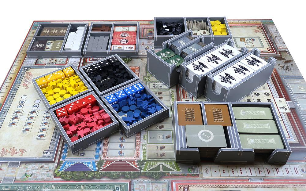 Stackable trays from the Folded Space insert packed inside game box