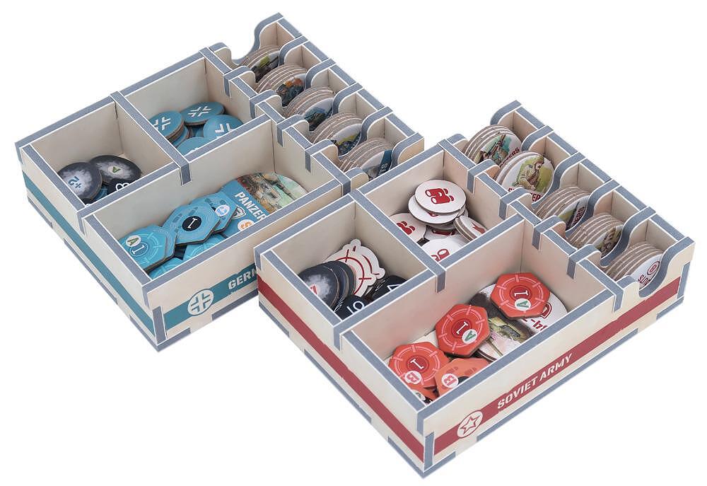 Organized game trays with various tokens and components sorted