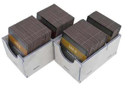 Close-up of sorted tokens and tiles in separate trays