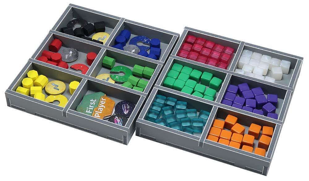 Grey board game organizer with compartments full of colorful wooden tokens, plastic cubes, and a "First Player" marker