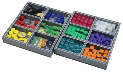 Grey board game organizer with compartments full of colorful wooden tokens, plastic cubes, and a "First Player" marker