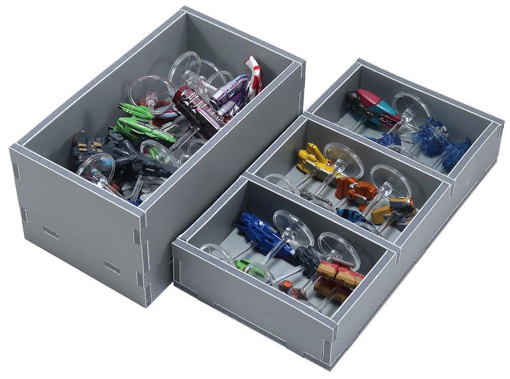 Colorful miniature spaceships on clear stands, organized in grey storage boxes and a multi-compartment tray