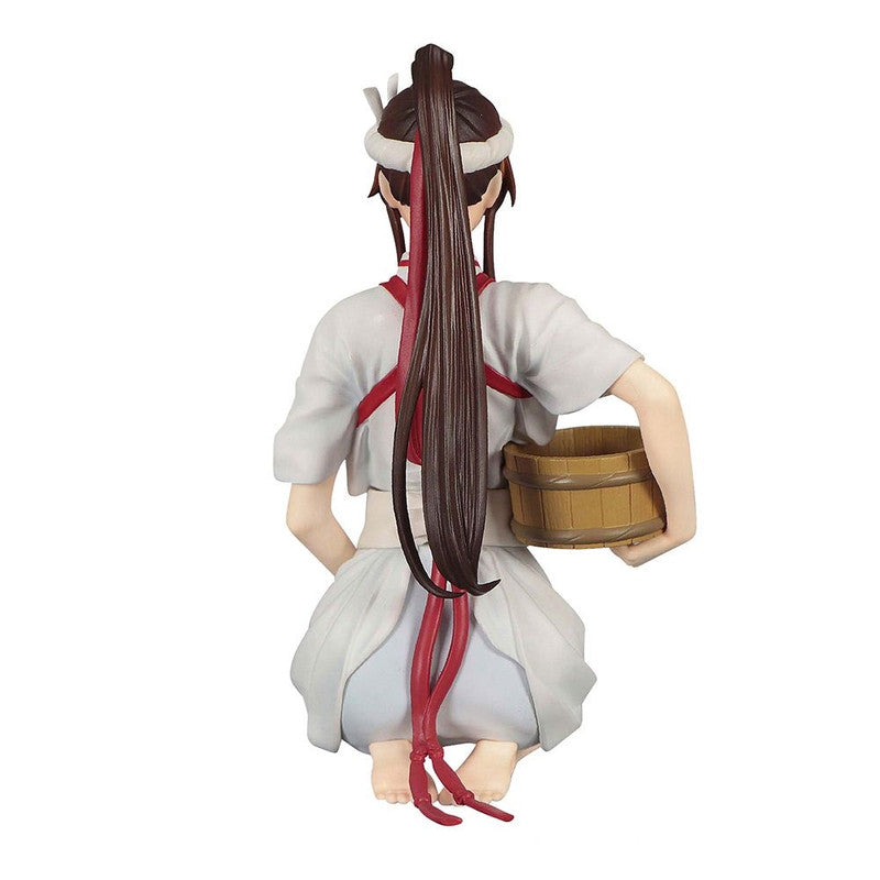 Anime figure kneeling with a bucket wearing white clothes with red accents and a high ponytail