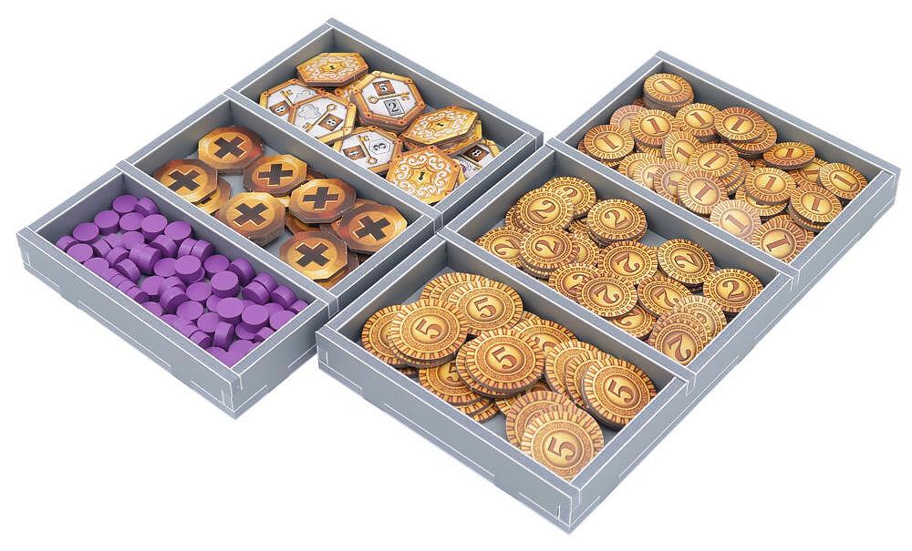Board game tokens and tiles in storage trays