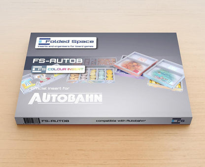 Black foam organizer insert with game components neatly arranged