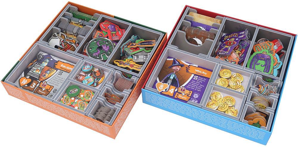 Two board game boxes, one orange and one blue, filled with game pieces and organizers.