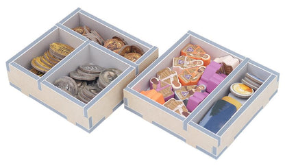 Wooden board game token organizers with stacked gold and silver coins, character tokens, and other game pieces.