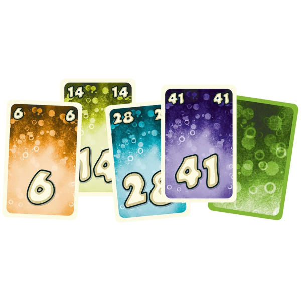 Spread of FTW?! card game components showing cards laid out with icons, numbers, and a central FTW?! rulebook on a light surface