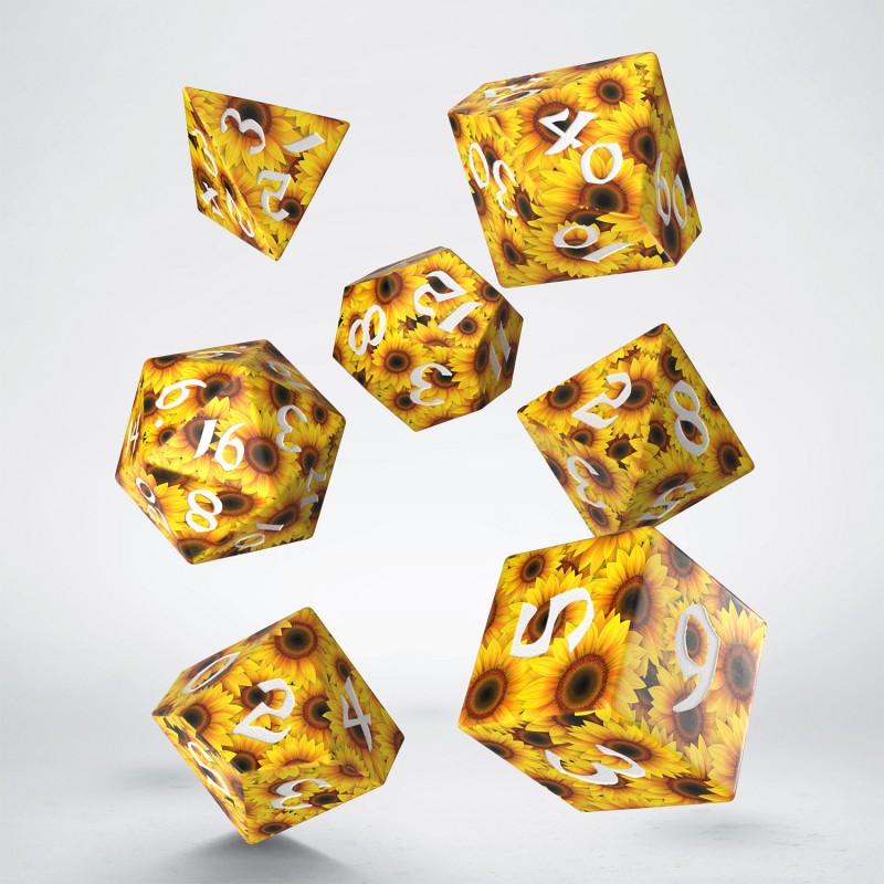 A set of seven Sunflower RPG Dice floats against a white background, featuring yellow sunflower patterns and clear white numbers
