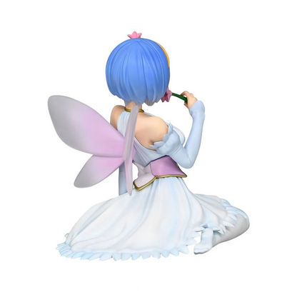 Fairy Rem anime figure in white dress with pink wings and blue hair holding a flower