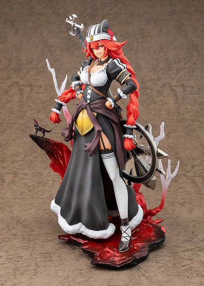 A figurine of a red-haired woman with long braids, wearing a black and white outfit, holding a cross staff. She stands on a dramatic base with a spiked wheel and small wolf