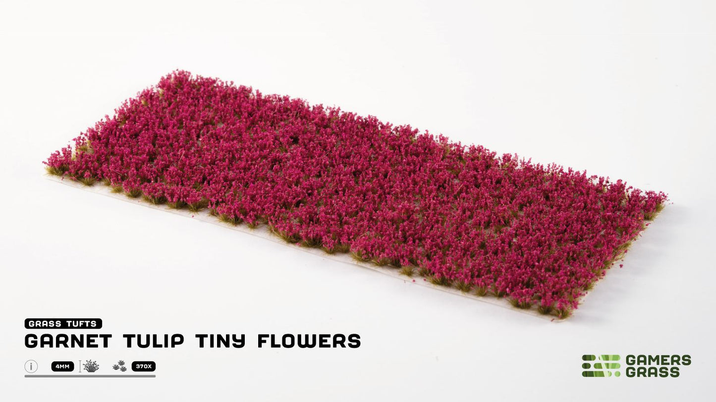 Model terrain: A strip of densely packed miniature flower tufts in a deep garnet (magenta) color