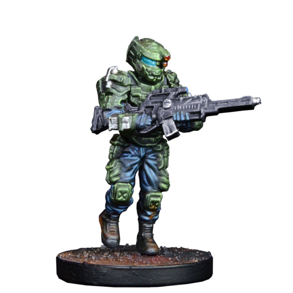 A miniature sci-fi soldier in green armor with a blue visor and red helmet lights, holding a rifle