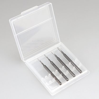 Four dark gray precision tools with chisel tips in an open clear plastic case