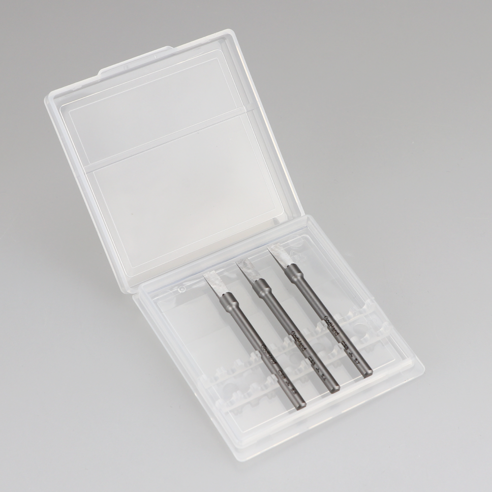 Three precision chisel blades displayed in an open clear plastic case