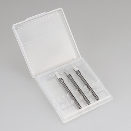 Three precision chisel blades displayed in an open clear plastic case
