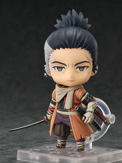 Sekiro Nendoroid action figure with gray hair and orange jacket holding a sword