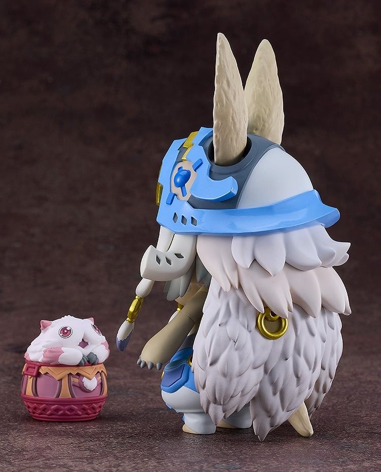 Nanachi New Outfit Ver Nendoroid figure kneeling beside a small white furry creature in a woven basket base