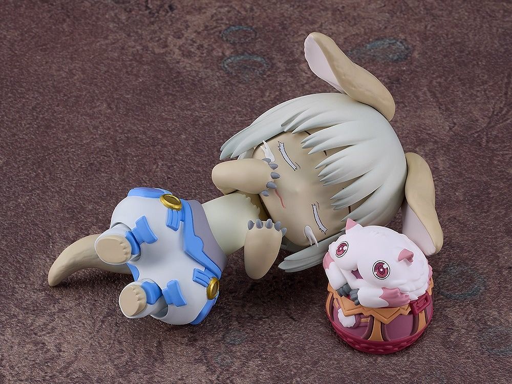 Made in Abyss The Golden City of the Scorching Sun Nanachi New Outfit Version Nendoroid figure laying on brown ground with furry creature