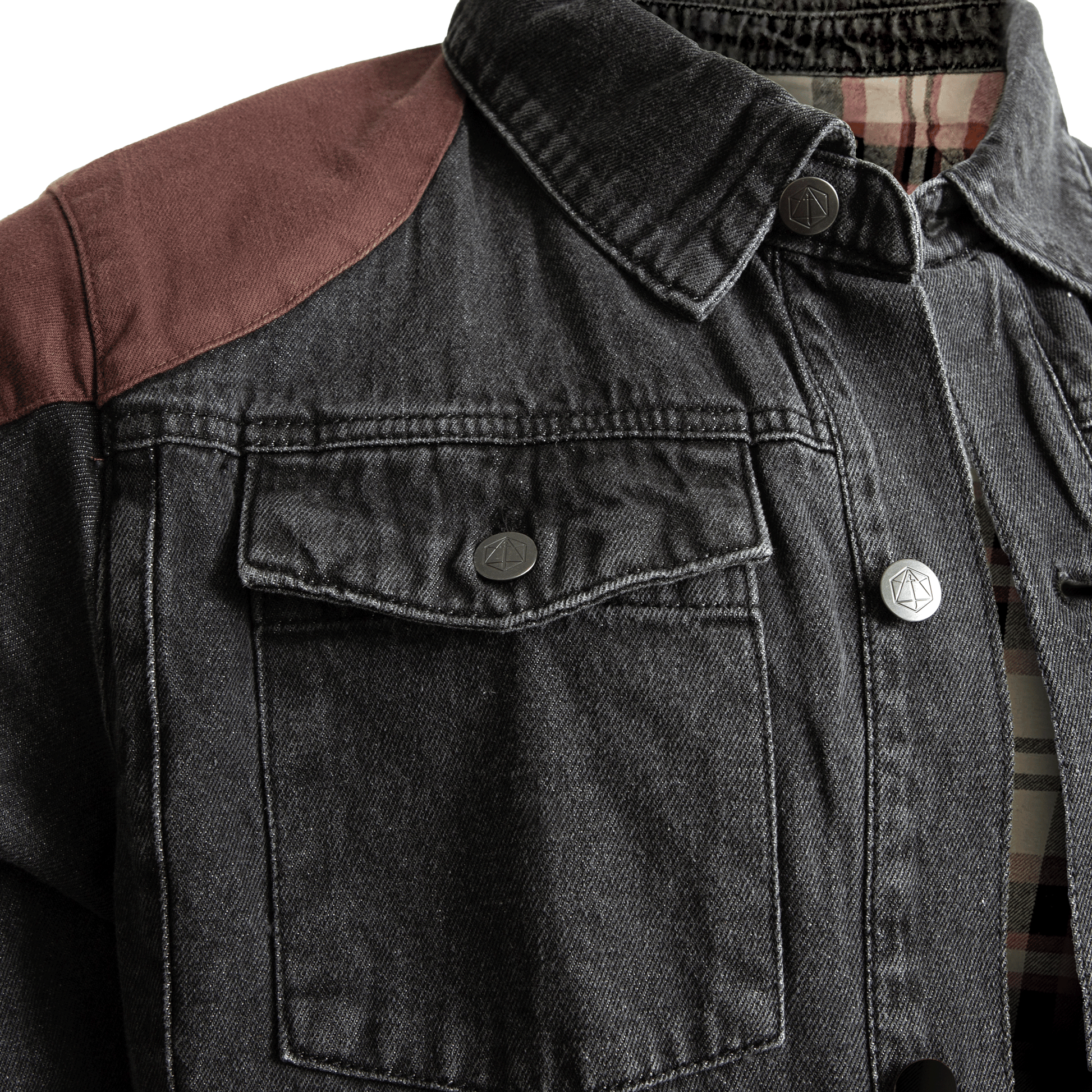 Dark grey denim jacket with brown shoulder patches, a chest pocket, and unique metal buttons over a plaid shirt