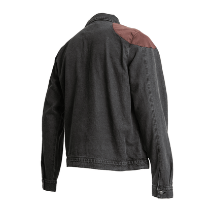 A faded dark grey denim jacket with brown fabric shoulder patches, viewed from the back