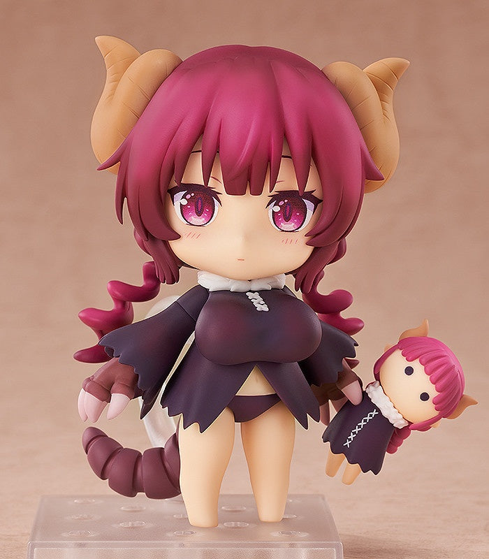 Chibi-style female figure with magenta hair horns purple dress tail and a smaller matching doll