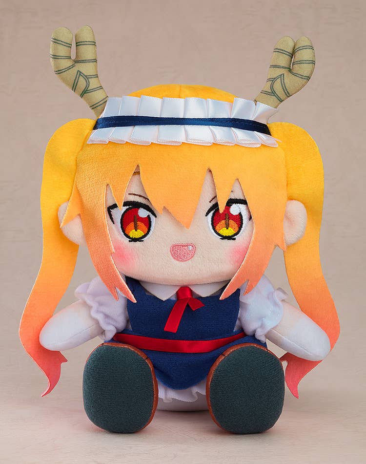 Plush toy of a character with yellow pigtails, horns, a blue maid dress with a red bow, and large red eyes