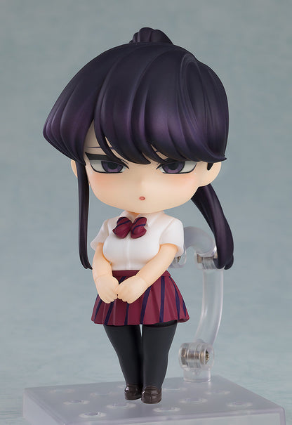 Komi Nendoroid holding notebook with alternate faceplate and hand accessories