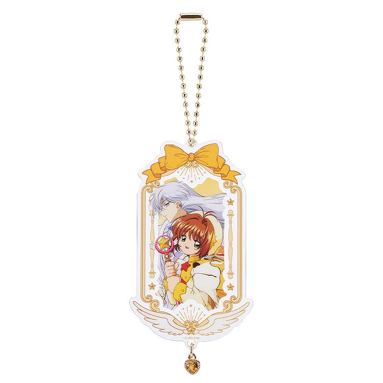 Cardcaptor Sakura 25th Anniversary acrylic keychain featuring Sakura and Yukito with a bow design