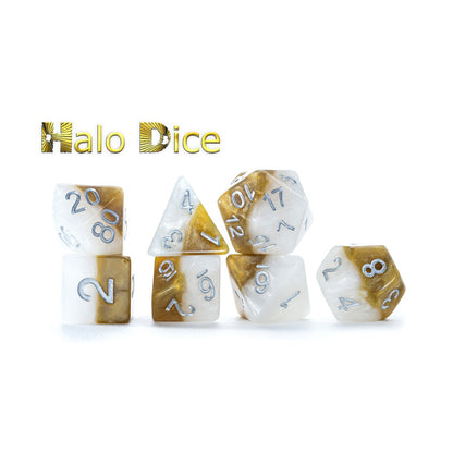Halo Dice: A set of two-toned white and metallic gold polyhedral dice with silver numbers.